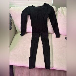 Women’s black full body suit